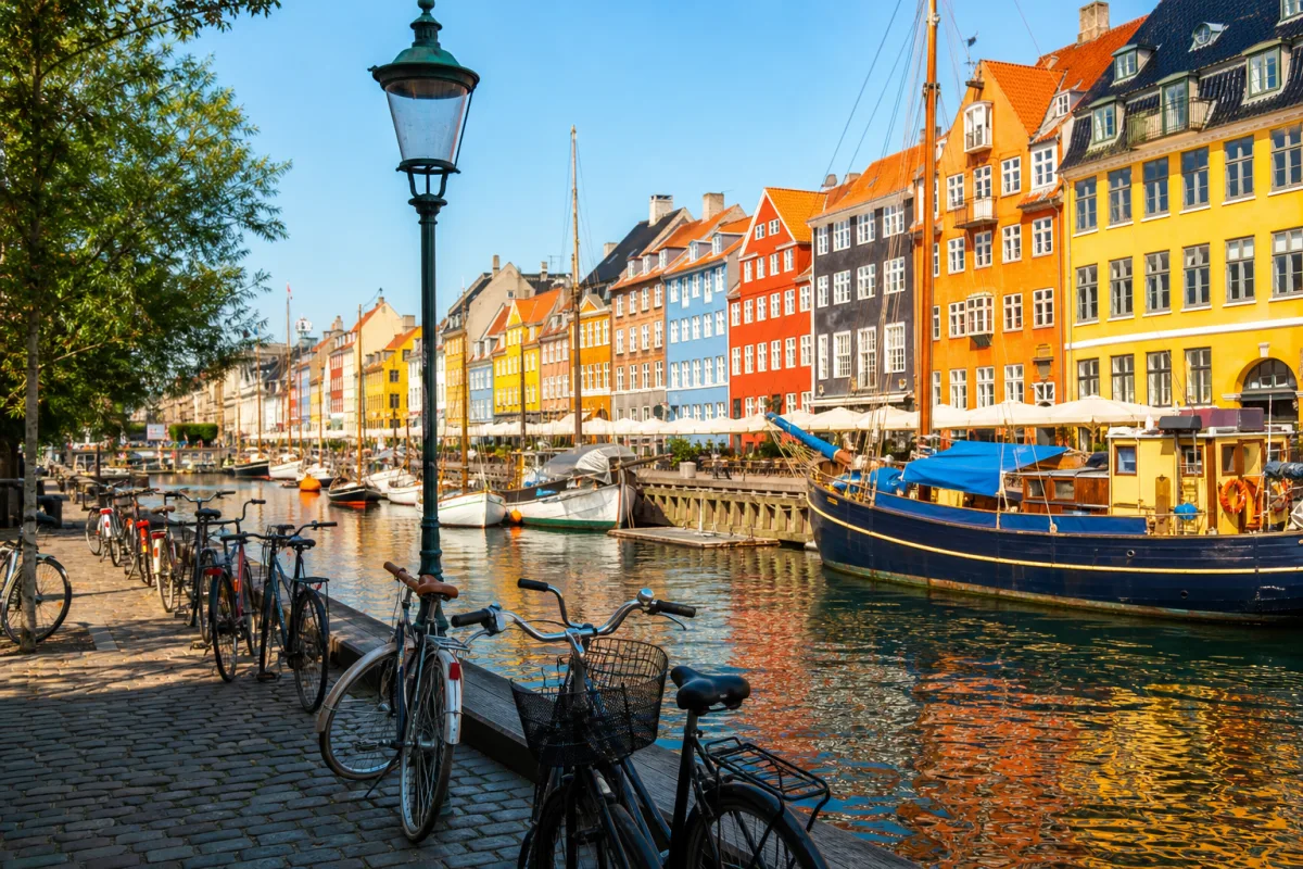Colourful harbour houses in Copenhagen with bicycles