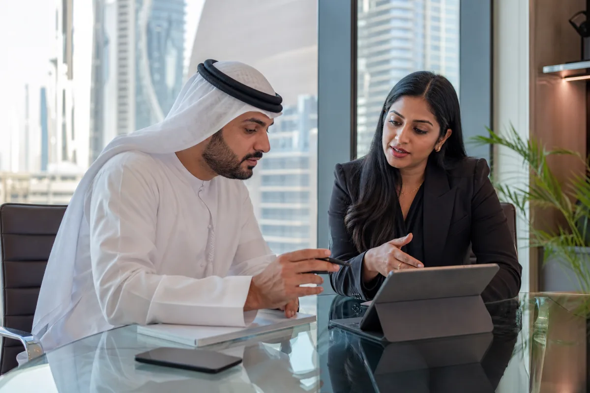 Business founders discussing company setup plans in a Dubai office
